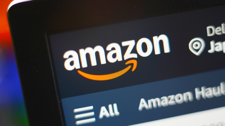 Close-up of the Amazon logo displayed on a screen.