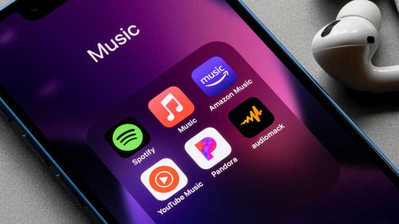 Amazon Music app icon displayed on a smartphone alongside other music streaming services.