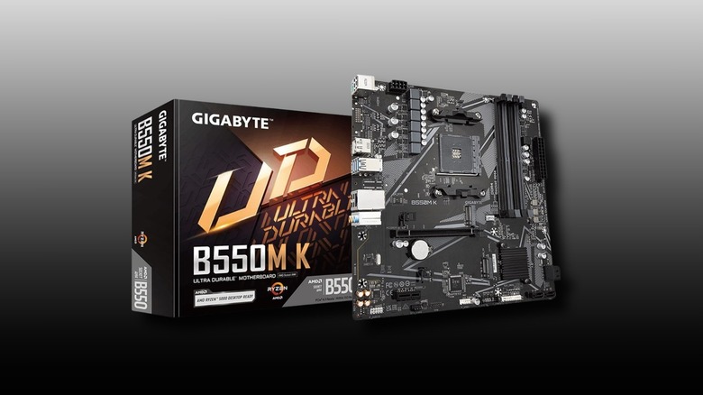 GIGABYTE B550M K AMD AM4 Micro-ATX Motherboard and box on a black to grey background.