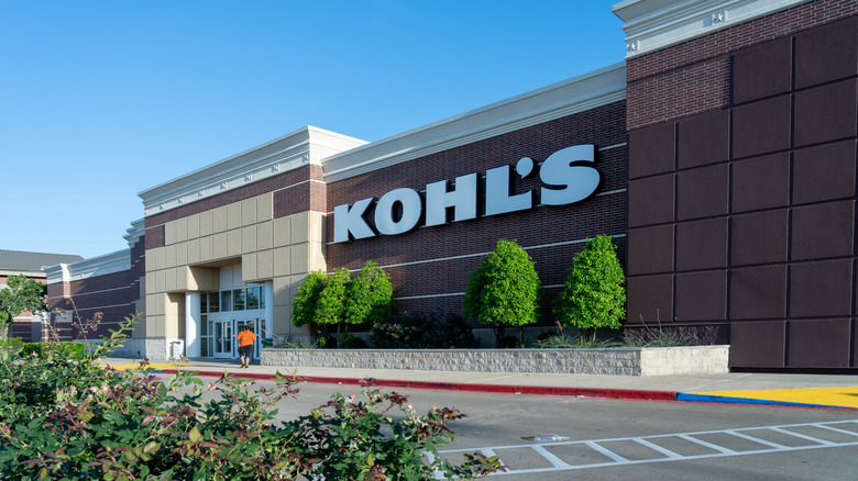 The front of a Kohl's store with a customer approaching the door