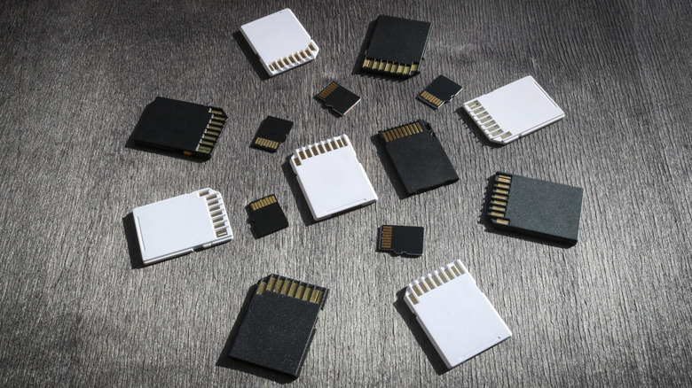 SD cards and microSD cards arranged on a table.
