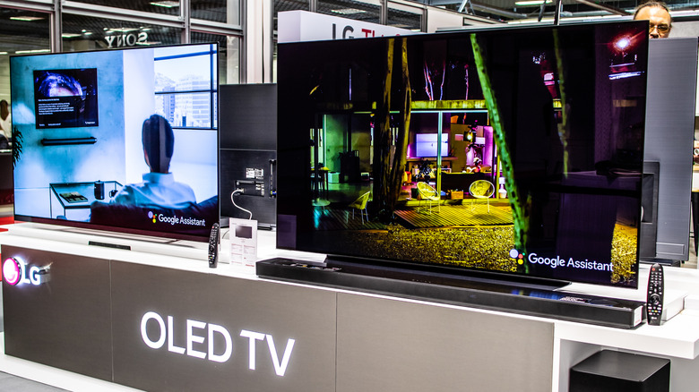 Two OLED TVs in a retail setting
