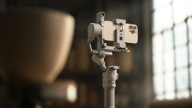 A phone attached to the DJI RS 4 Mini gimbal