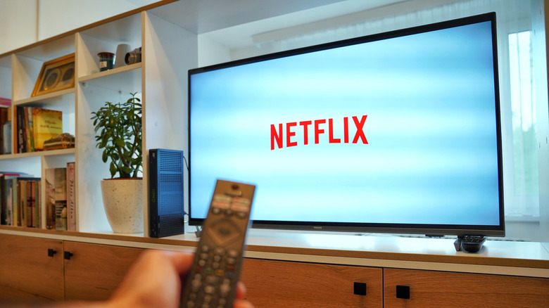 Netflix screen on smart TV and a remote in front