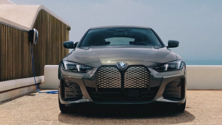 The 2026 BMW i4 parked and plugged for charging.