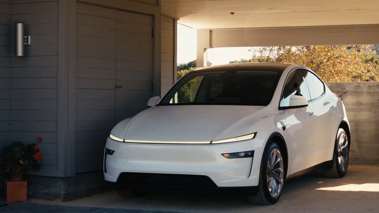 The Tesla Model Y parked in a home garage.
