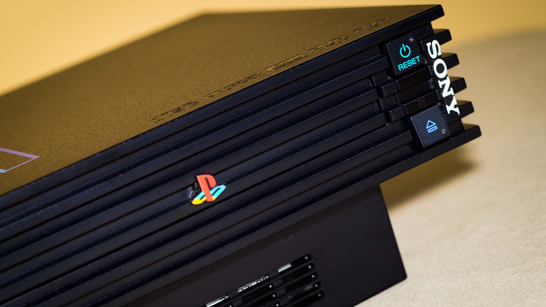 A closeup of the PlayStation 2's eject and power buttons.