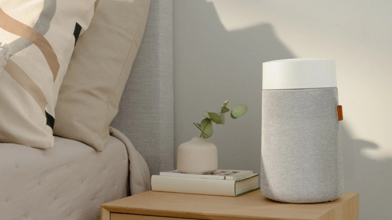 The Blueair Blue Pure Mini Max air purifier on a bedside table.