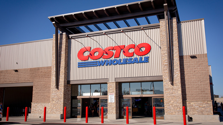 The front of a Costco store with the company logo.