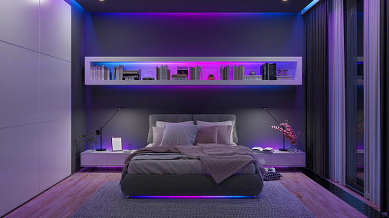 A bedroom with smart lights installed in several places.