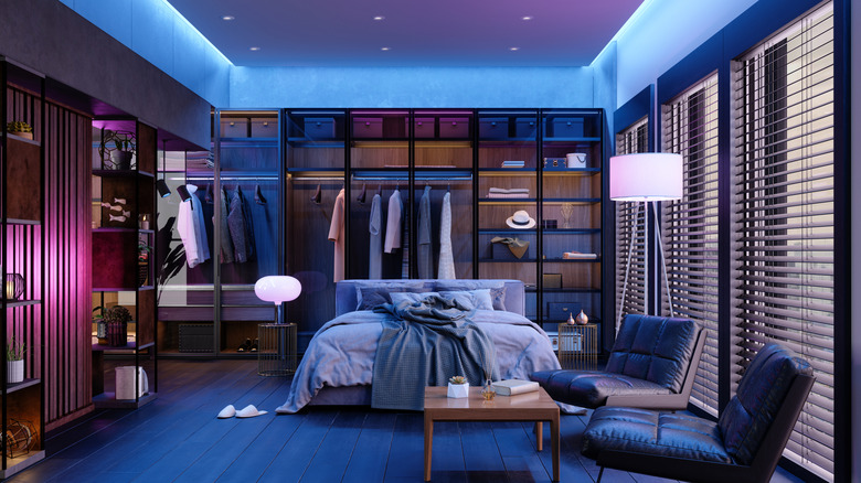 A bedroom with smart lights installed in various places.