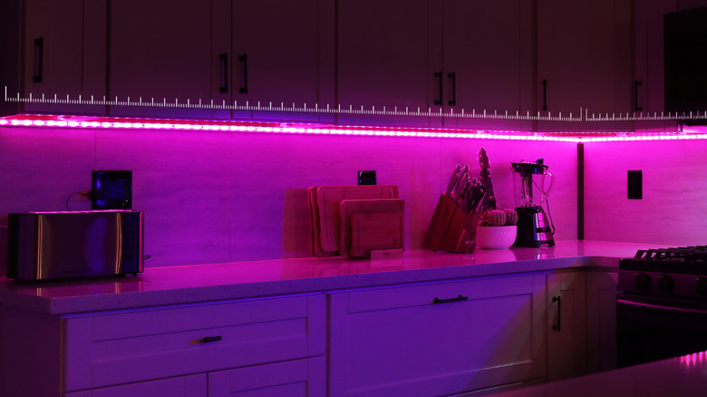 The Kasa KL400L5 smart light strip installed above a kitchen countertop.