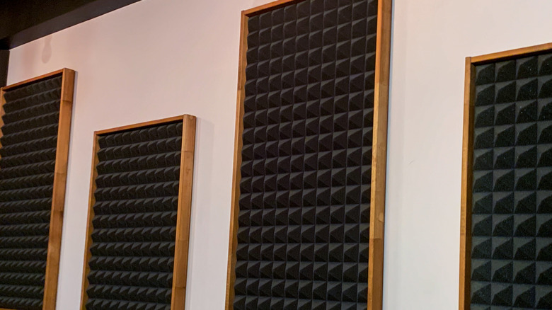 Recording studio with acoustic wall panels