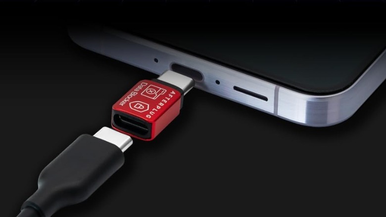 The Afterplug USB-C Data Blocker being connected to a smartphone