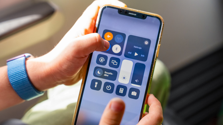 Airplane Mode being activated on an iPhone.