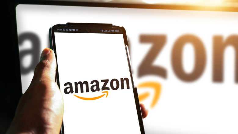 amazon logo on a smartphone plus larger in the background