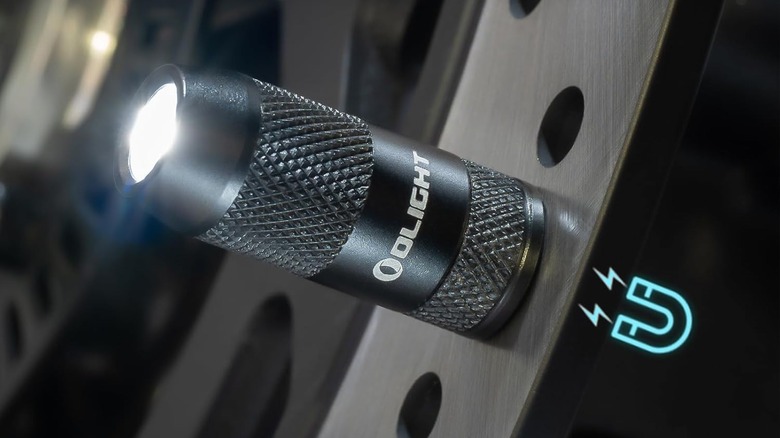 OLIGHT IMINI 2 EDC Rechargeable Keychain Flashlight magnetized to metal surface