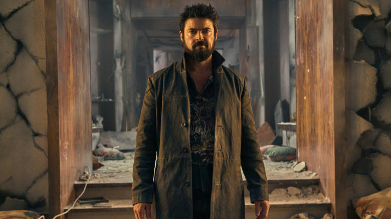 Billy Butcher (Karl Urban) stood in a ruined hallway in The Boys