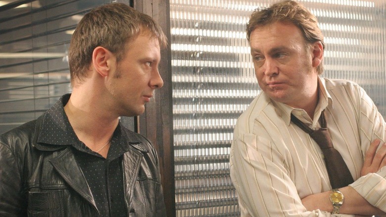 DCI Sam Tyler (John Simm) looking at Gene Hunt (Philip Glenister) in Life on Mars