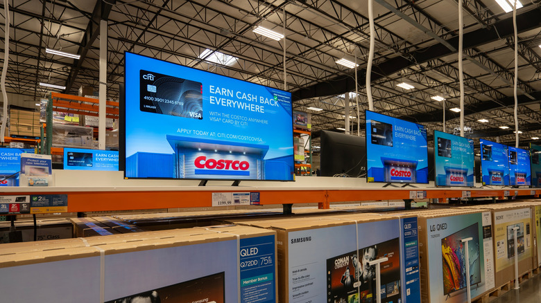 TVs on display in a Costco store