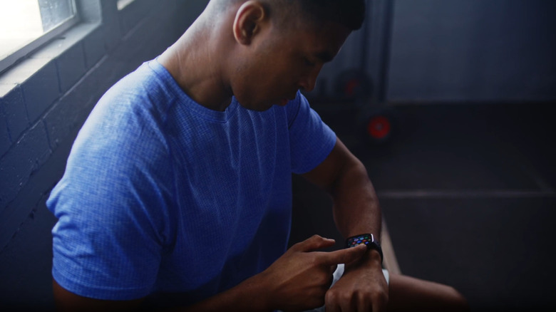 A man configuring his Amazfit Bip 6 before a workout