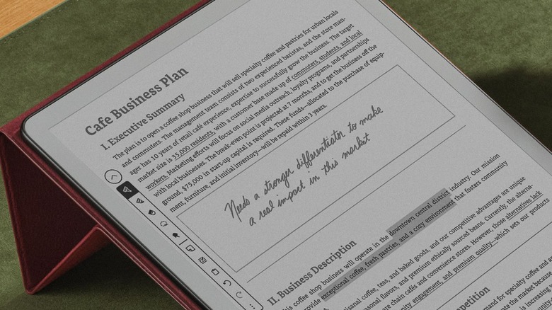 Kindle Scribe without front light, zoomed in close with cafe business plan showing