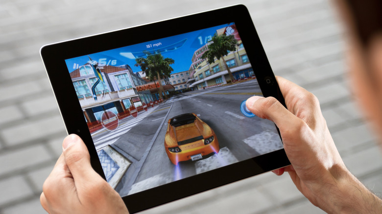 Playing a racing game on a tablet