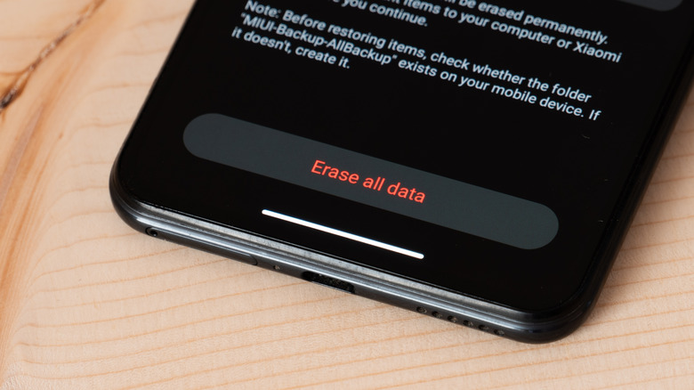 A smartphone showing the option to erase all data