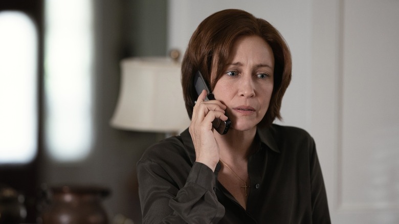 Dr. Anna Pou looking shocked on the phone.