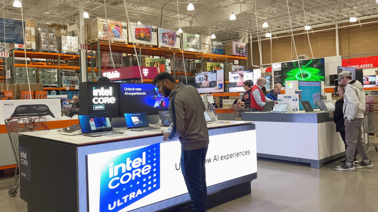 Costco patrons in the electronics section