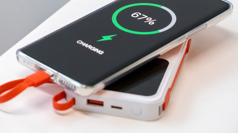 A phone being charged with a power bank