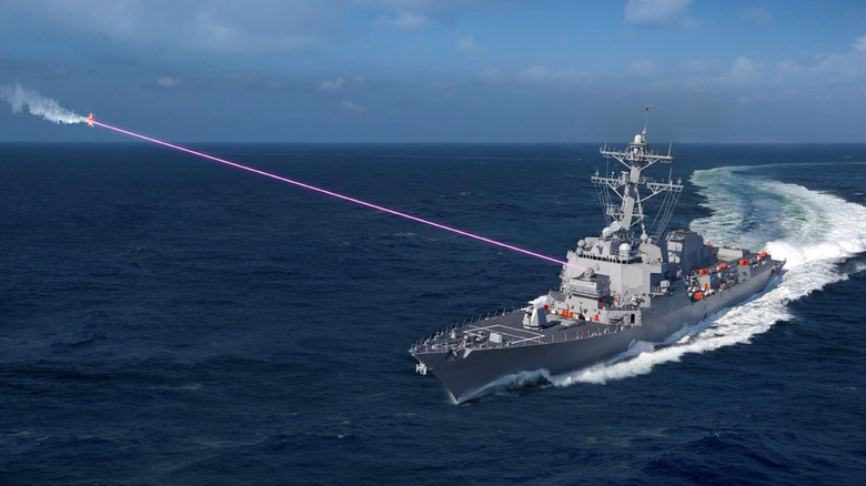 Aircraft carrier shooting drone out of the sky with laser