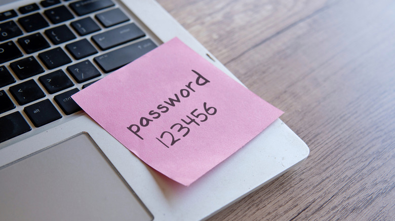 sticky note with easy password set on laptop