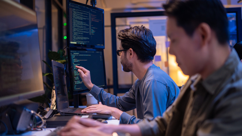 Two people coding
