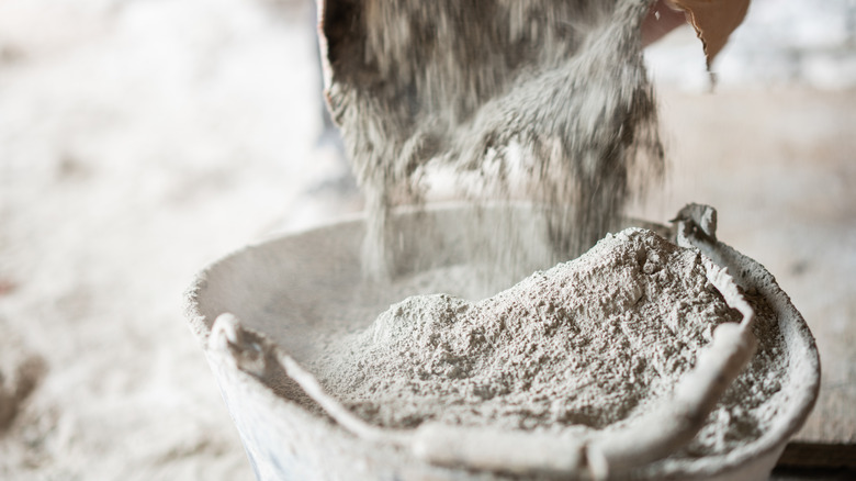 Bucket being filled with cement