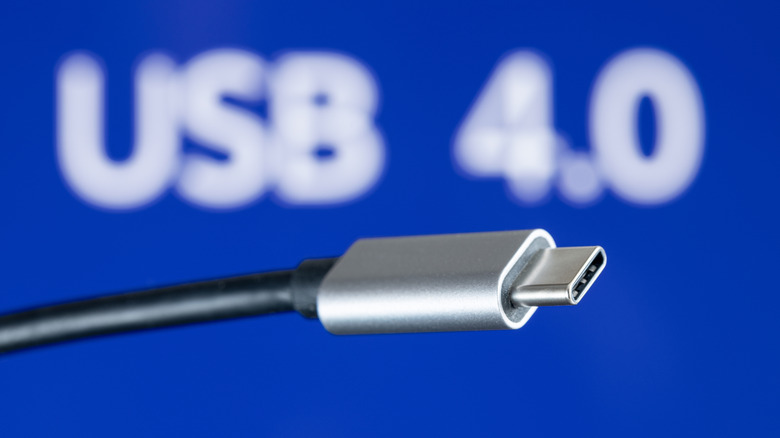 A photograph of a USB4 cable on a blue background.