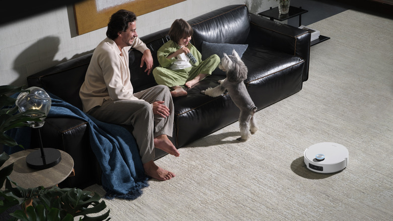 Dreame Aqua10 Ultra Roller navigating over a rug