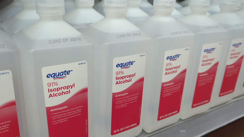 Bottles of isopropyl alcohol on a store shelf.