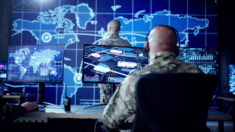 Soldiers in a digitally-driven communications center