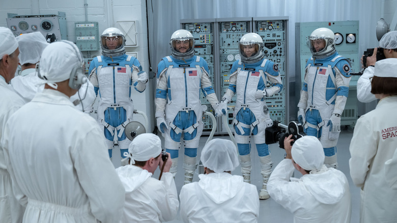The Fantastic Four standing in their spacesuits