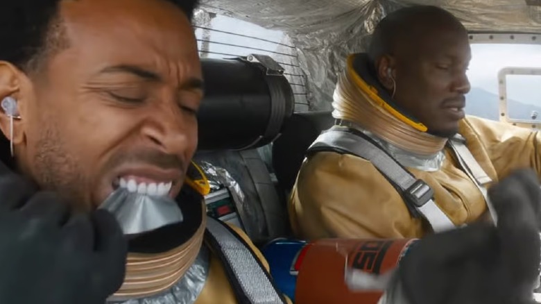 Roman and Tej in their space suits in F9
