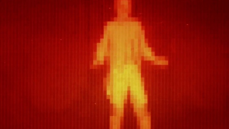 An example of the CGI used in 1973's "Westworld," the image depicts a human being standing as shown from the perspective of a robot, giving the image its red and orange appearance