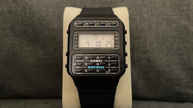 A Casio CD-30 watch in black sitting on a soft display