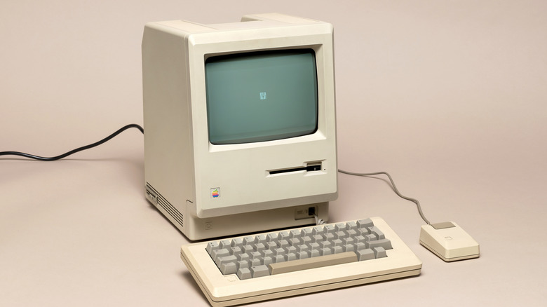 An old computer on a gray or beige backdrop