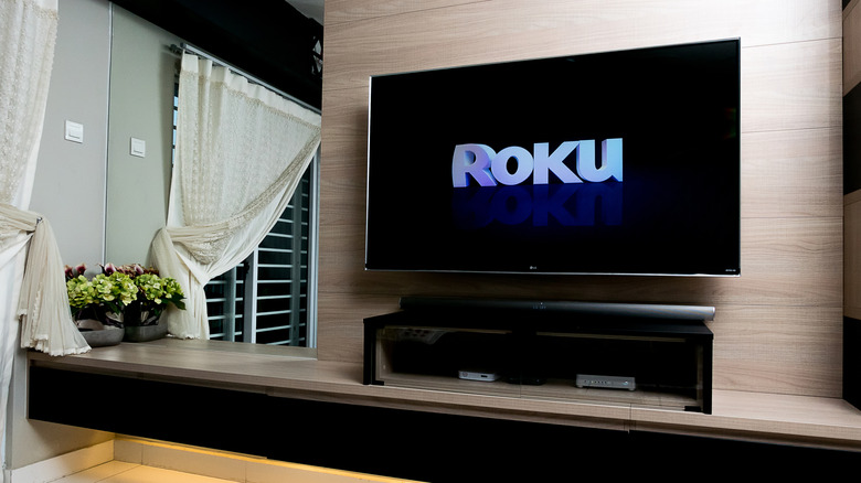 TV showing Roku logo in a living room concept