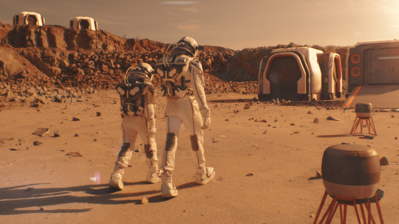 Two astronauts walking on Martian surface