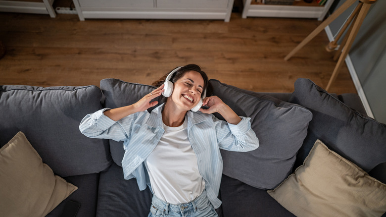 A person using headphones at home.