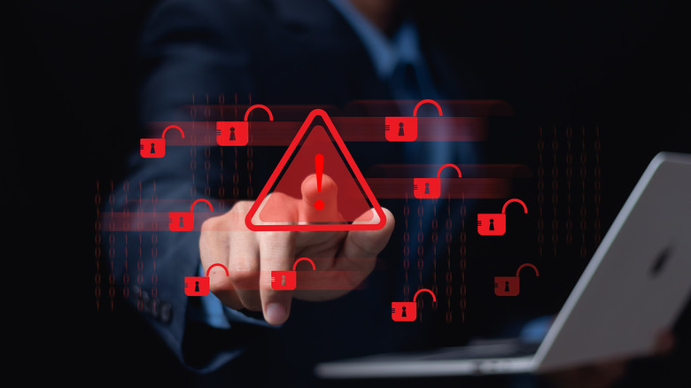 A laptop is compromised by a hack, with various alert icons hovering nearby.