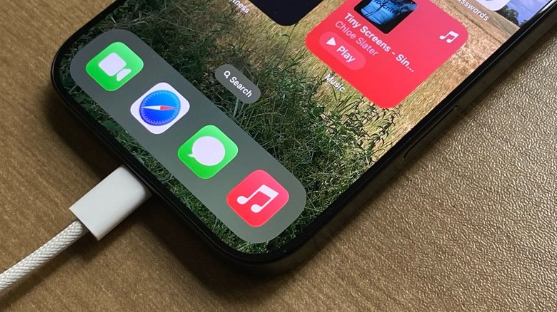 An iPhone being charged via its USB-C port