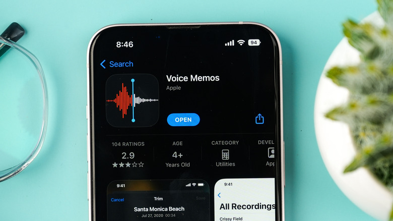 An iPhone on a blue backdrop displaying the Voice Memo app within the Apple App Store.